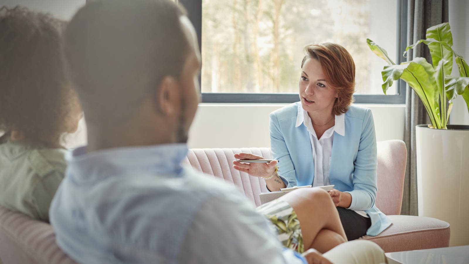 Therapist talking to couple in couples therapy session