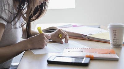 Focused female college student studying in classroom
