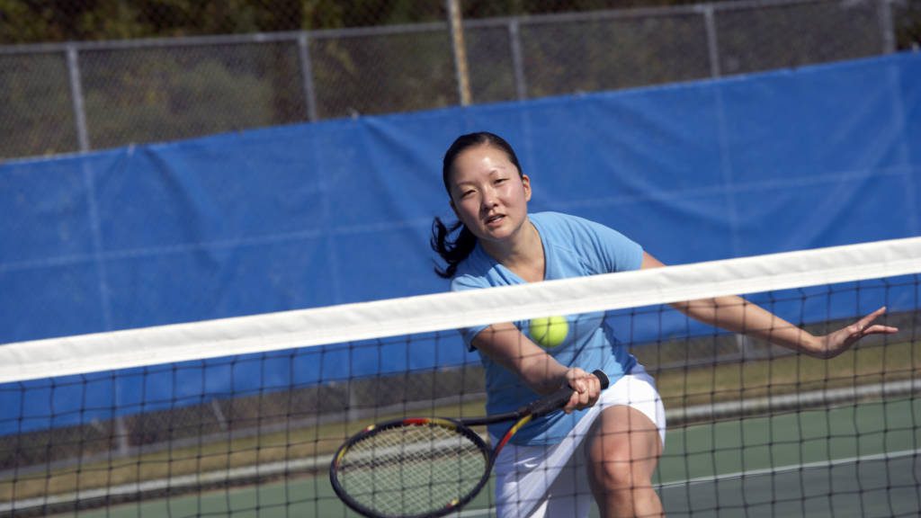 College athlete playing tennis