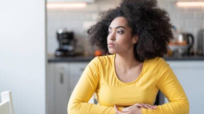 Student looking out the window and pondering what college to attend